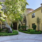 Front of yellow Spanish Mediterranean house
